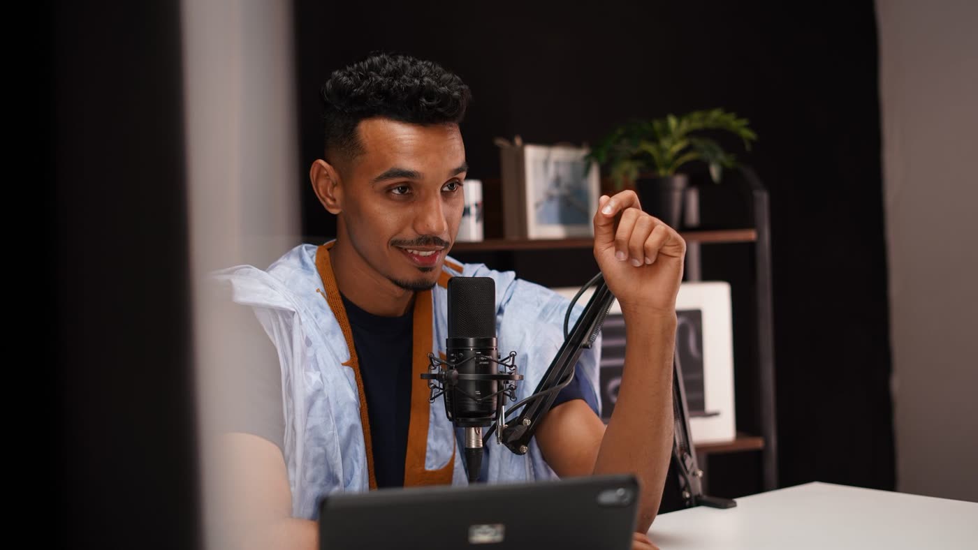 Speaker talking into a studio microphone